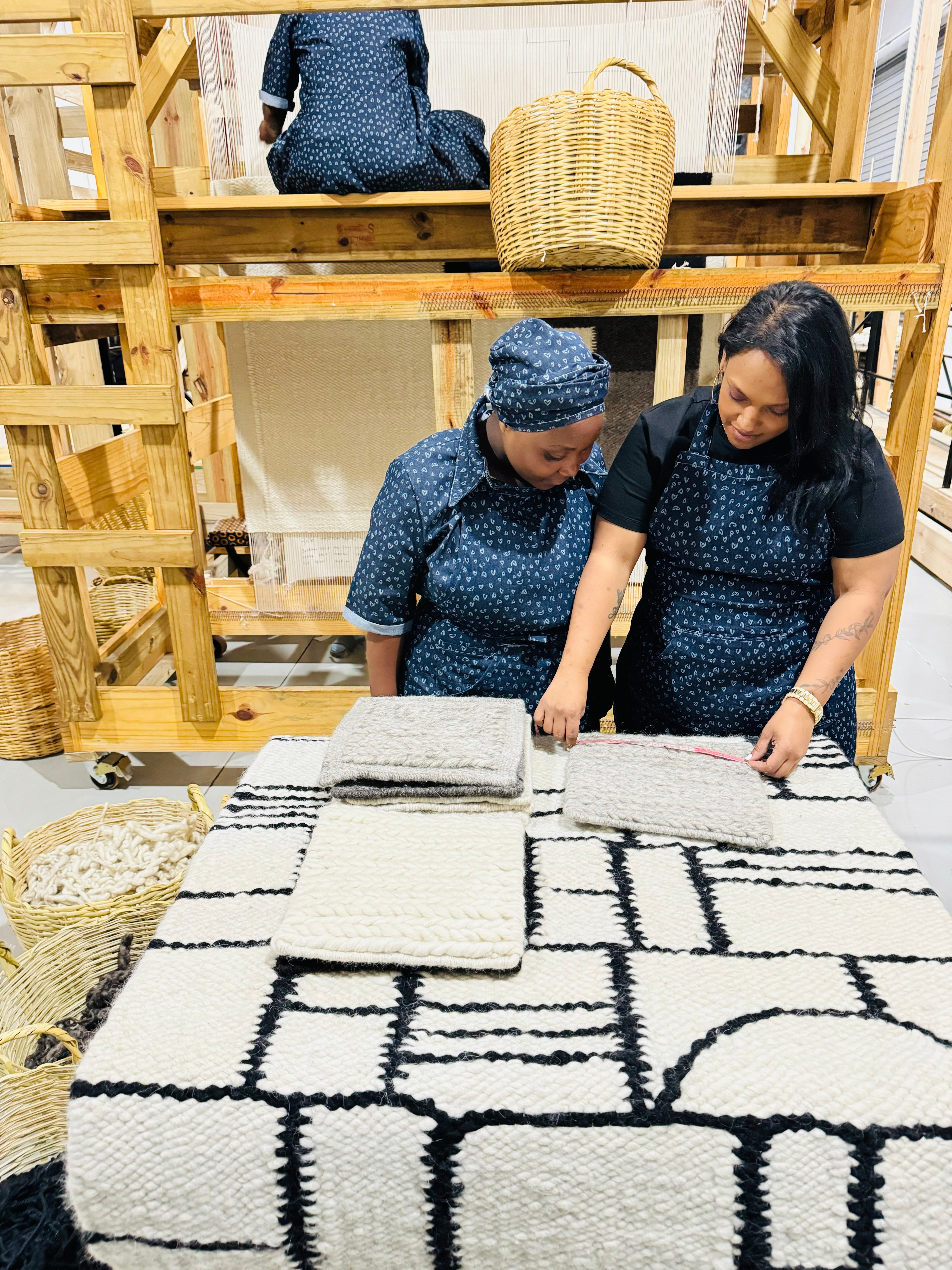 Training to handcraft wool rugs at Living Well Interiors Durban South Africa