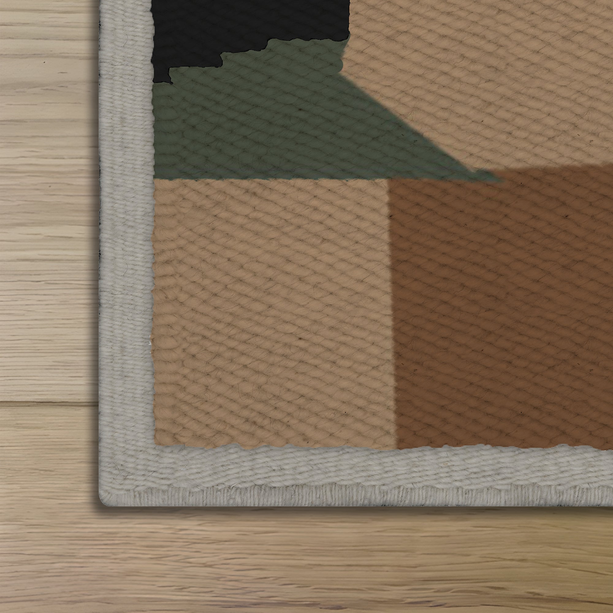 Close-up of a textured rug corner with geometric pattern on a wooden floor.